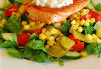 Pan Fried Salmon With Lemon Mayonnaise On A Bed Of Mixed Salad